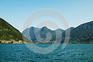 Panoramic view on Iseo lake with montains how background