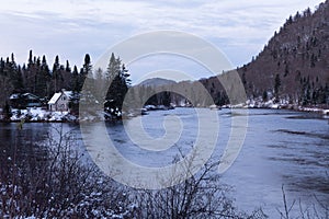 Panoramic view of the Jacques-Cartier National Park with its river and a small abandoned cabin