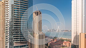 Panoramic view of JBR area and the famous Ferris Wheel aerial morning timelapse