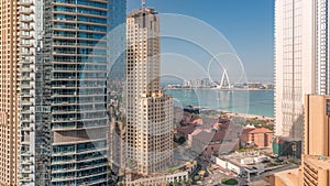 Panoramic view of JBR area and the famous Ferris Wheel aerial morning timelapse