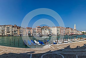 Panoramic view on jetty with gondolas on a Grand Canal in Venice, Italy