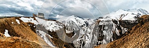 Panoramic view on Jinvali Water Reservoir blue lake in Caucasian Mountain in winter. Cross Pass in Georgia. Gudauri District. Sour photo