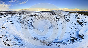 Panoramic view of the Kerid Volcano Iceland with snow and ice i