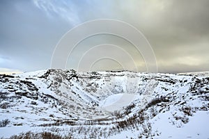 Panoramic view of the Kerid Volcano Iceland with snow and ice i