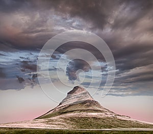 Panoramic view of Kirkjufell mountain under heavy clouds