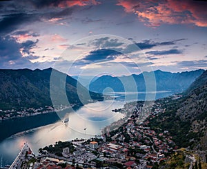 Panoramic view of Kotor bay at sunset. Dramatic overcast sky.