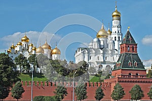 View of Kremlin wall with tower and Cathedrals photo made from opposite bank of the river Moscow photo