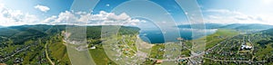 Panoramic view of Lake Baikal and serpentine road - aerial view of natural mountain valley with serpantine road, Trans