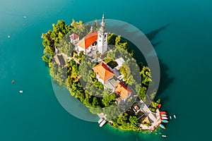 Panoramic view of Lake Bled with Assumption of Maria Church on island on the background of Julian Alps mountains in