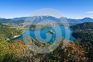 Panoramic view of lake Bled, island in the middle and old castle in background