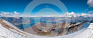 Panoramic view of lake Como and surrounding mountains as seen from Monte San Primo summit