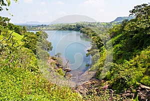 Panoramic view of a lake flanked by greenery photo