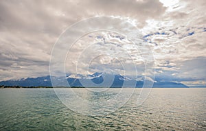 Panoramic view of Lake Geneva, one of Switzerland`s most cruised lakes in Europe, with sky full of clouds after the rain