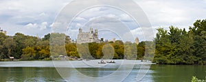 Panoramic view of The Lake in New Yorks Central Park with autumn foliage