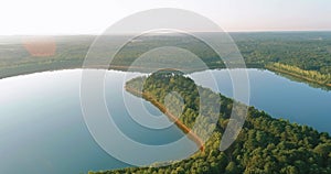 Panoramic view of landscape with morning fog over the lake near the forest