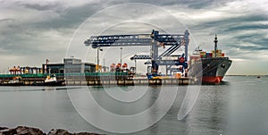 Panoramic view of container ship in port.