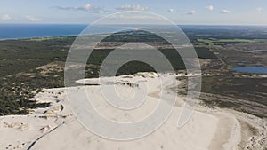 Panoramic view of large sand dunes in the middle of Denmark`s forest.