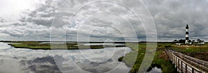 Panoramic view of lighthouse and surrounding marshlands photo