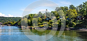 Panoramic view of Lindoya island on Oslofjord harbor near Oslo, Norway, with Lindoya Ost marina and summer cabin houses at