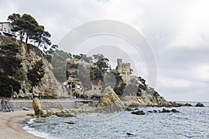 Panoramic view of Lloret de Mar Castle at sunset, Costa Brava between Barcelona and Girona, Spain. Ancient Fortress in photo