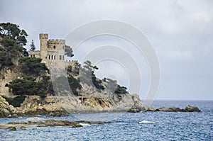 Panoramic view of Lloret de Mar Castle at sunset, Costa Brava between Barcelona and Girona, Spain. Ancient Fortress in photo