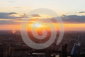 Panoramic view of the London city skyline illuminated by sunset light