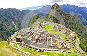 Panoramic view of Machu Picchu lost city at archaeological ruins site in Peru - Exclusive travel destination and natural wonder