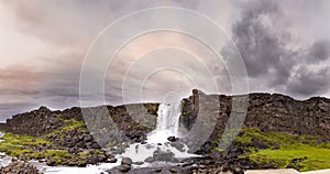 Panoramic view of majestic waterfall in Pingvellir natural park