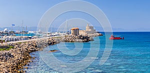 Panoramic view of Mandraki harbor and marina in the place of the Colossus of Rhodes. Mooring yachts and vessels.  Ancient