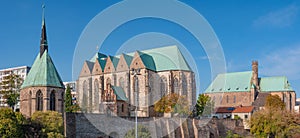 Panoramic view of Maria Magdalena Chapel, Saint Petri Church and Evangelical Church at Autumn in Magdeburg, Germany, at sunny day