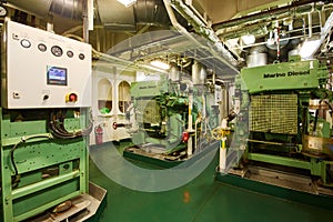 Panoramic view of marine diesel generators on a merchant ship in the engine room