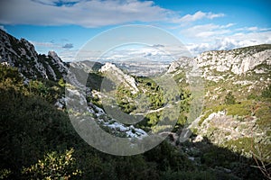 Panoramic view on Marseille behind a valley and hills