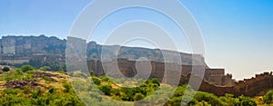 Panoramic view of Mehrangarh fort from Rao Jodha desert rock park, Jodhpur, India. Green vegetation in the foreground and