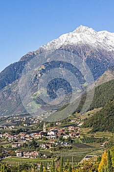 Panoramic view of Merano in Italy with mountains in background.