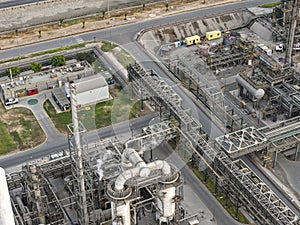 Panoramic view of metal, mechanical and piping structures in an oil and gas refinery