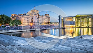 Berlin government district with Reichstag and Spree river in twilight, central Berlin Mitte, Germany photo