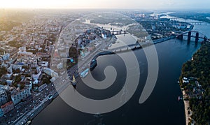 Panoramic view of a modern city with a river, unfinished bridge and park part of the city