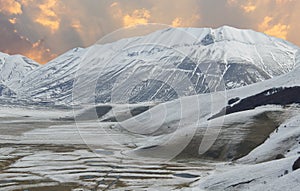 View of Monte Vettore at sunset covered by snow in Umbria photo