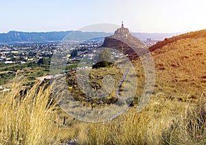 Panoramic view of Monteagudo Christ statue and castle at sunset in Murcia, Spain. Replica of the well-known Christ located on the