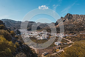 Panoramic view of Montejaque town surrounded by mountains on a sunny day photo