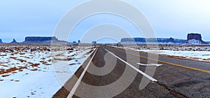 Panoramic view of Monument Valley road after snowfall.