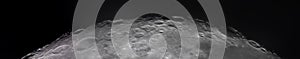 Panoramic view of the Moon surface, showcasing intricate details of its craters and rugged terrain. The image captures