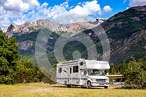 Panoramic view of MOTORHOME RV In Chilean landscape in Andes. Family trip traval vacation in mauntains
