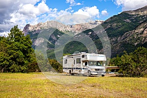 Panoramic view of MOTORHOME RV In Chilean landscape in Andes. Family trip traval vacation in mauntains