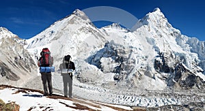 Mount Everest from Pumo Ri base camp with two tourists