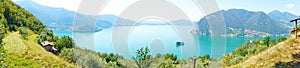 Panoramic view of mountain lake with island in the middle. Panorama from Monte Isola Island with Lake Iseo. Italian landscape. Is