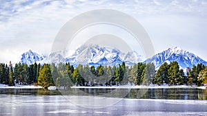 Winter landscape with lake and reflection