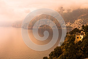 Panoramic view of the mountain landscape of Amalfi on the Mediterranean coast in the morning fog, Italy