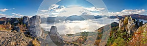 Panoramic view of mountain landscape with foggy valley