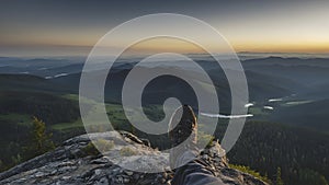 Panoramic view from a mountain peak reveals a vast landscape photo